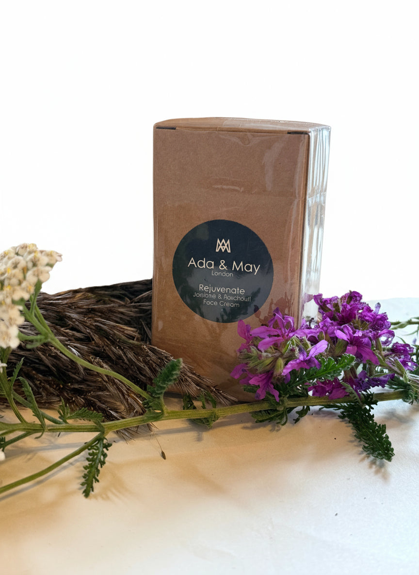 Rejuvenate Box of Ada & May with dried herbs and flowers on a cardboard background