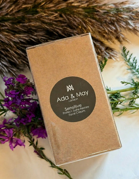 Sensitive Brown box with Ada & May branding on a natural background with flowers