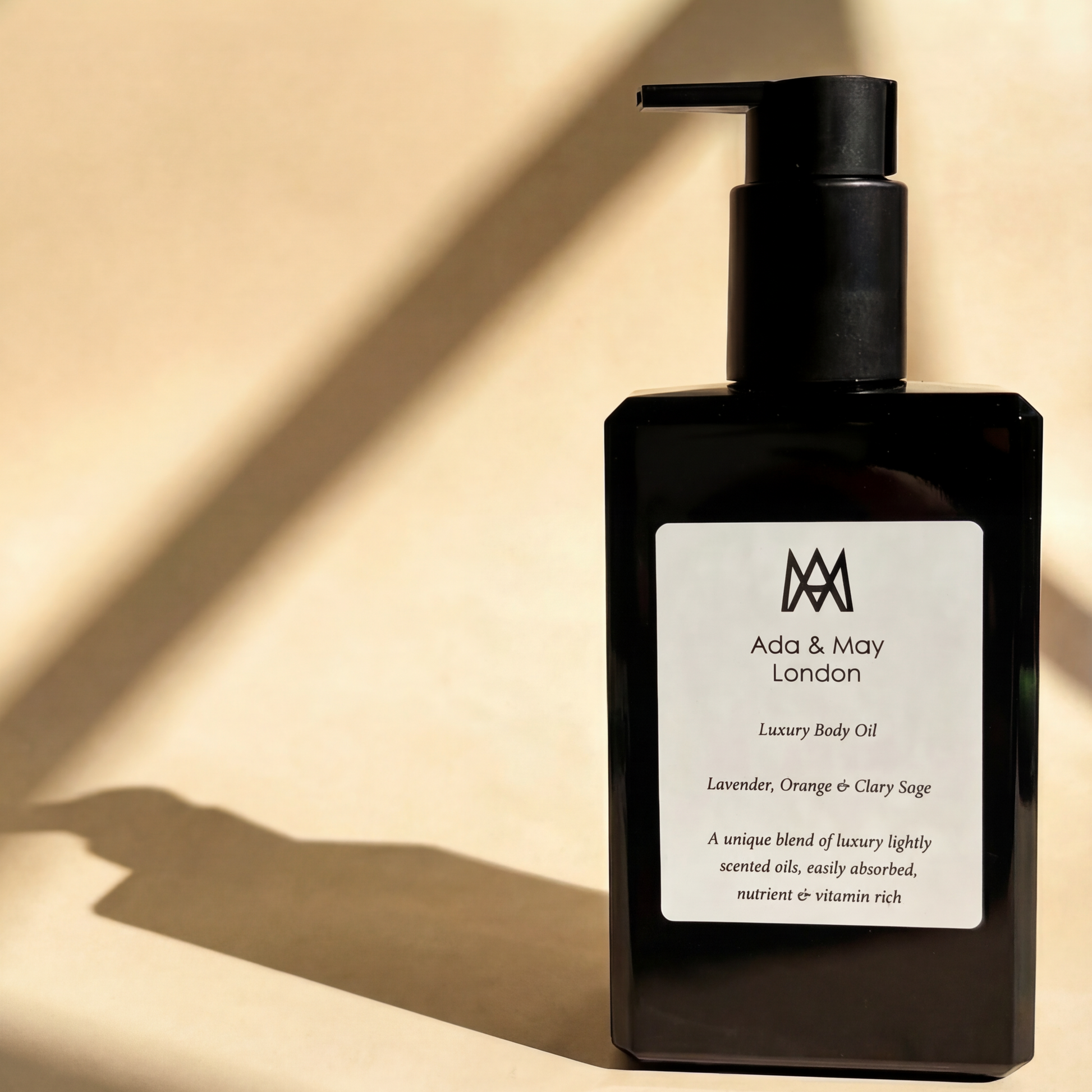 Black body oil bottle with pump on a beige background