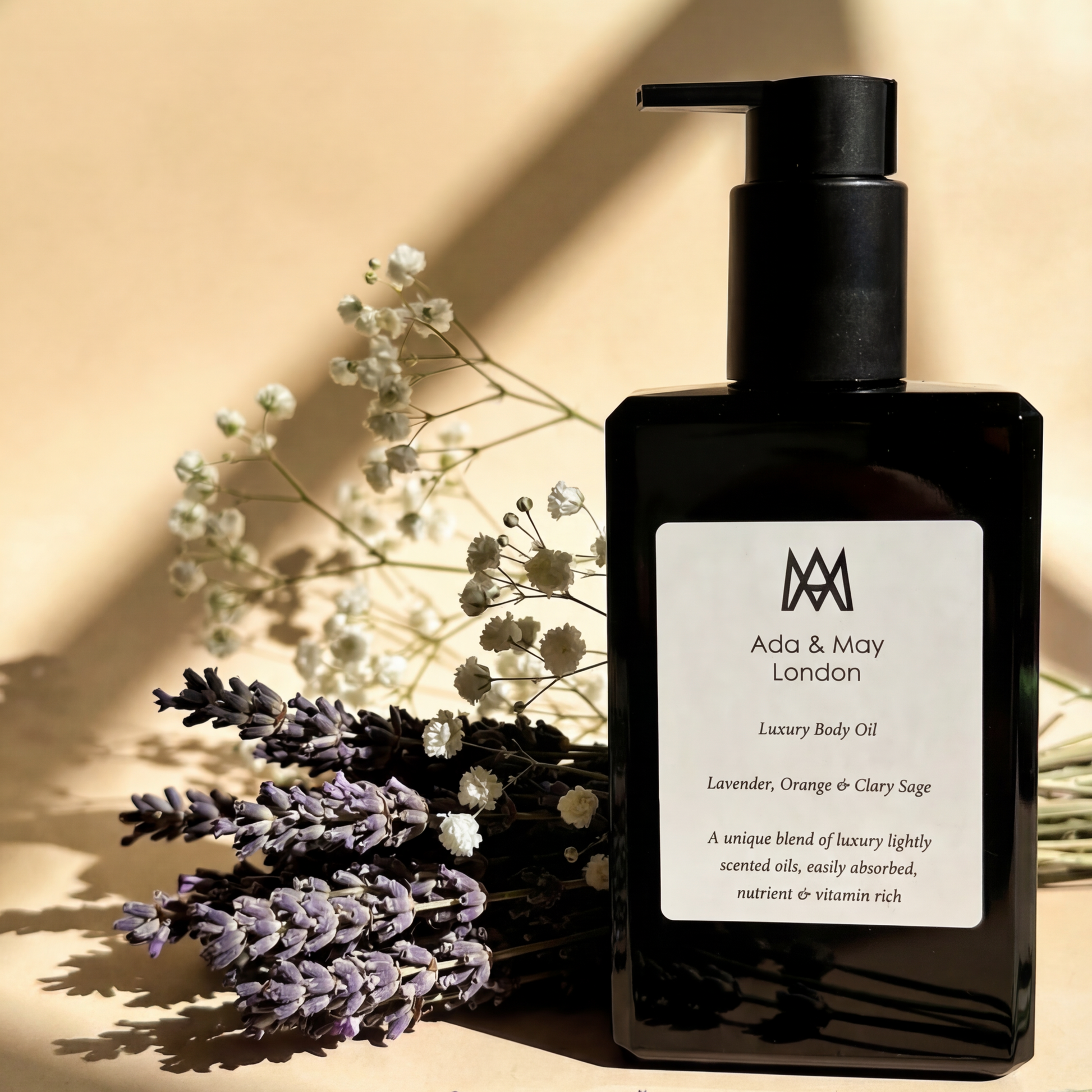 Black bottle of Ado & May with lavender flowers on a beige background