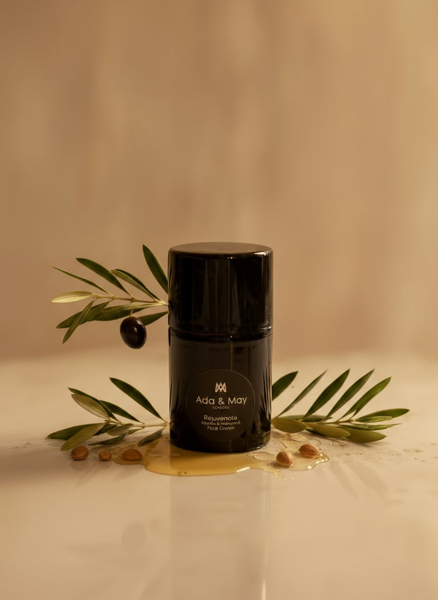 Rejuvenate Black cylindrical container with brand logo on a light gray background